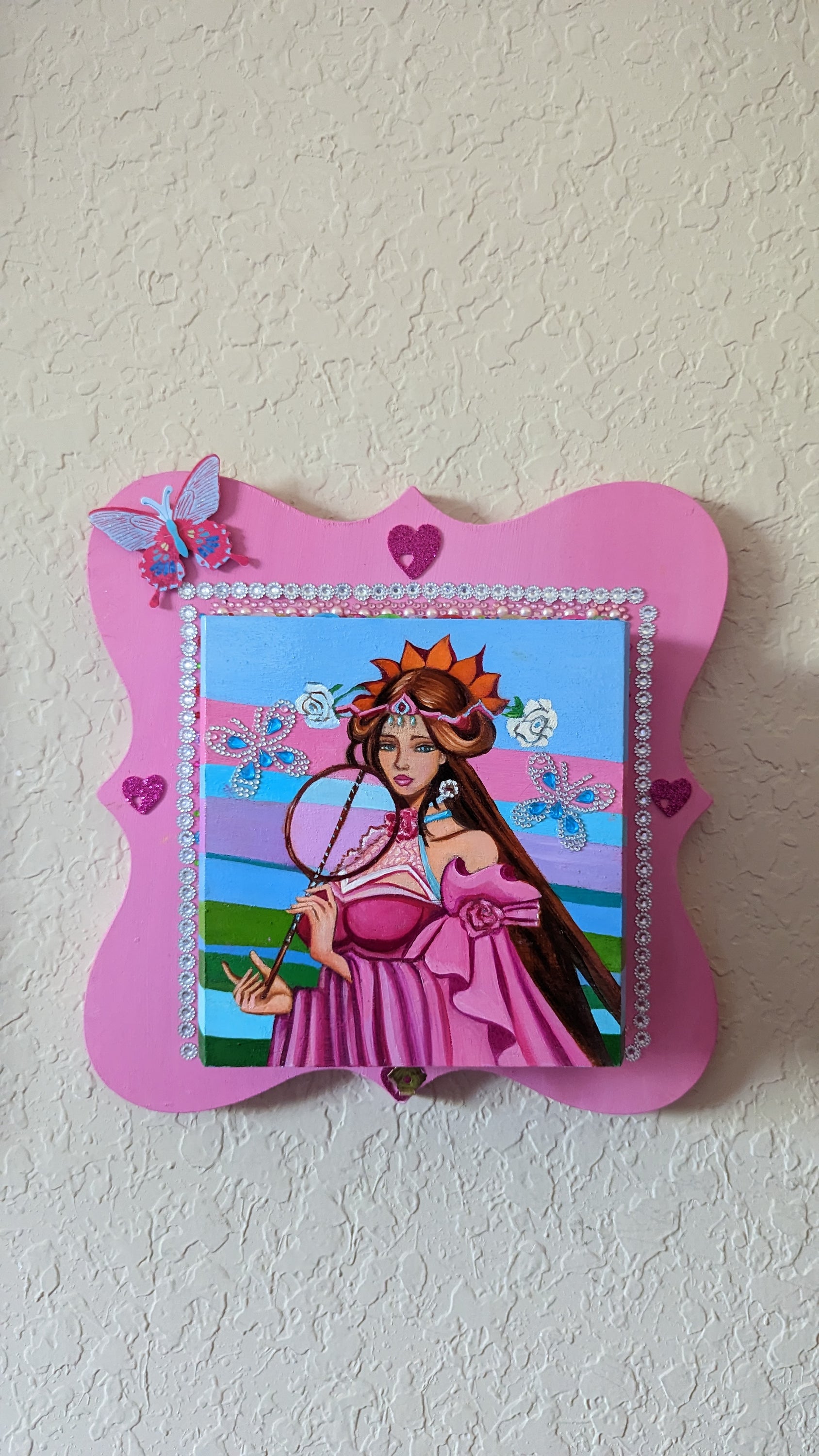 A beautifully hand-decorated Wish Box by Sharon Tatem featuring a powerful maiden in vibrant colors, symbolizing dreams and magic.