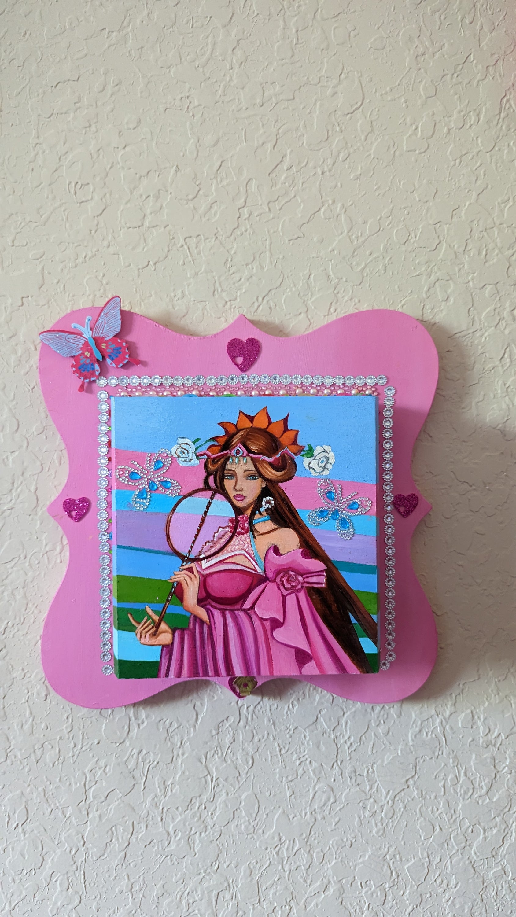 A beautifully hand-decorated Wish Box by Sharon Tatem featuring a powerful maiden in vibrant colors, symbolizing dreams and magic.