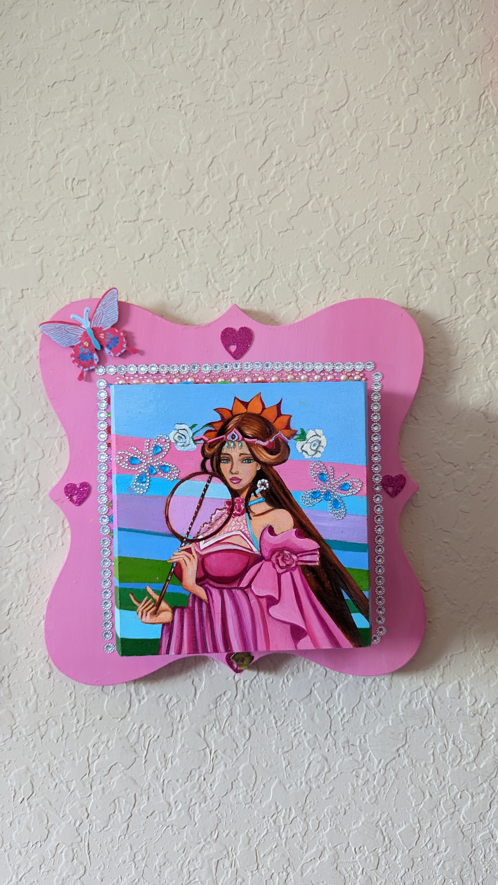 A beautifully hand-decorated Wish Box by Sharon Tatem featuring a powerful maiden in vibrant colors, symbolizing dreams and magic.