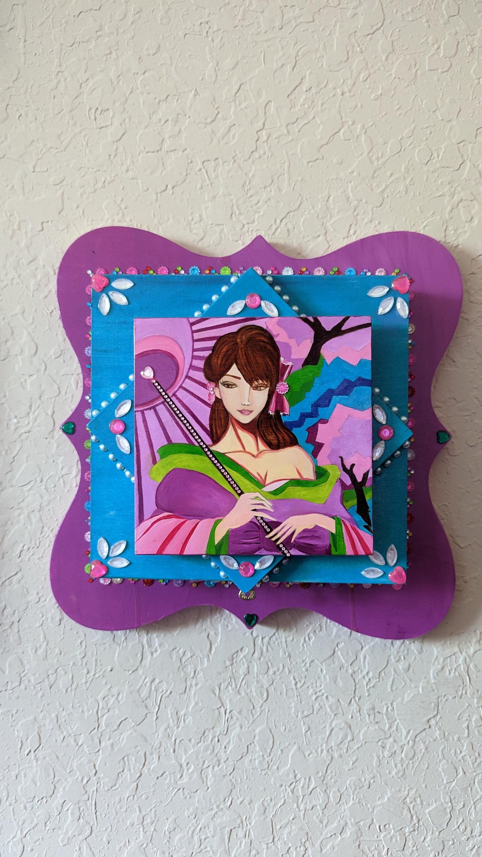 A beautifully hand-decorated Wish Box by Sharon Tatem featuring a powerful maiden, showcasing intricate designs and vibrant colors.