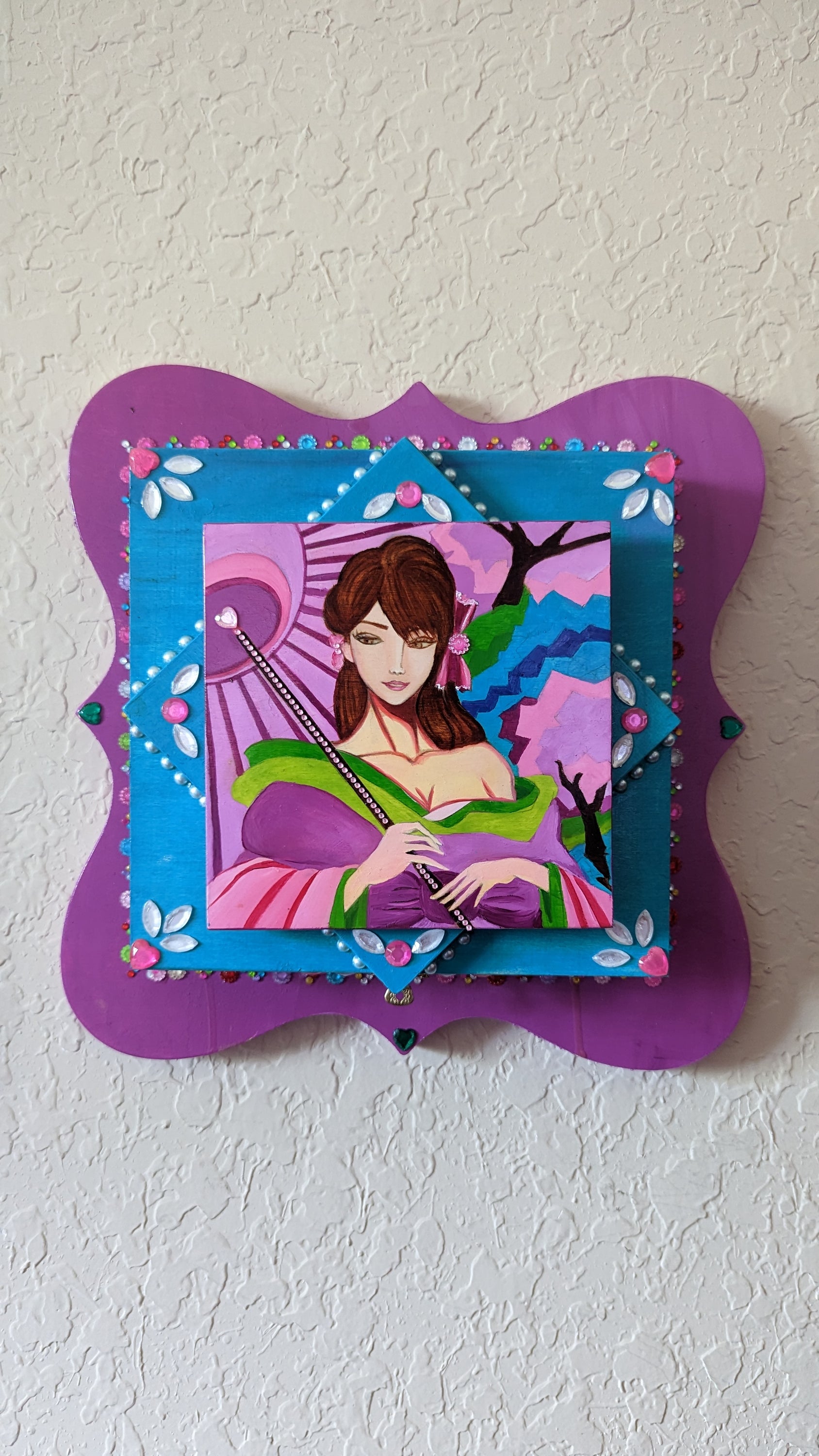 A beautifully hand-decorated Wish Box by Sharon Tatem featuring a powerful maiden, showcasing intricate designs and vibrant colors.