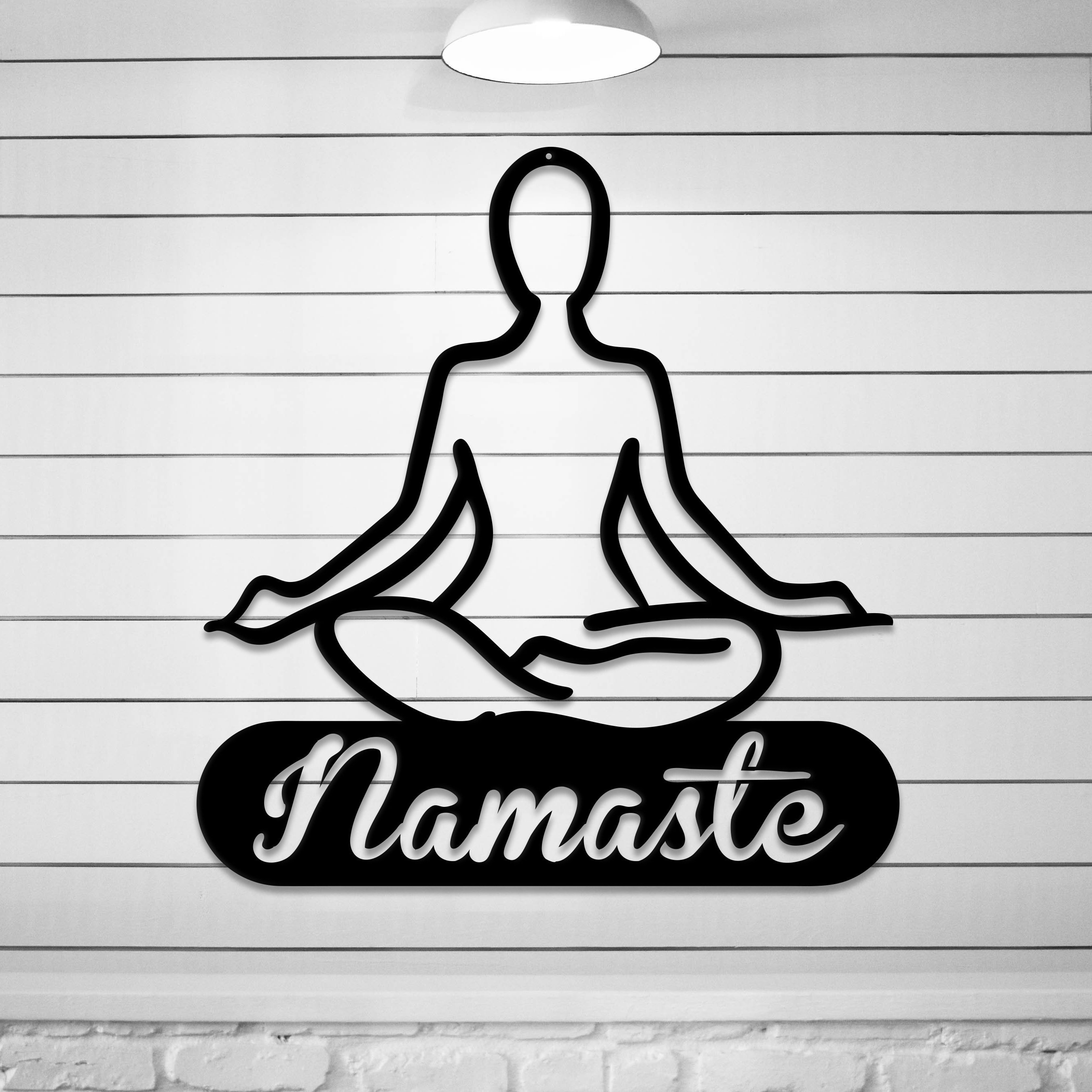 Namaste Metal Wall Art made from durable 14 gauge steel, featuring a peaceful design suitable for indoor and outdoor decor.