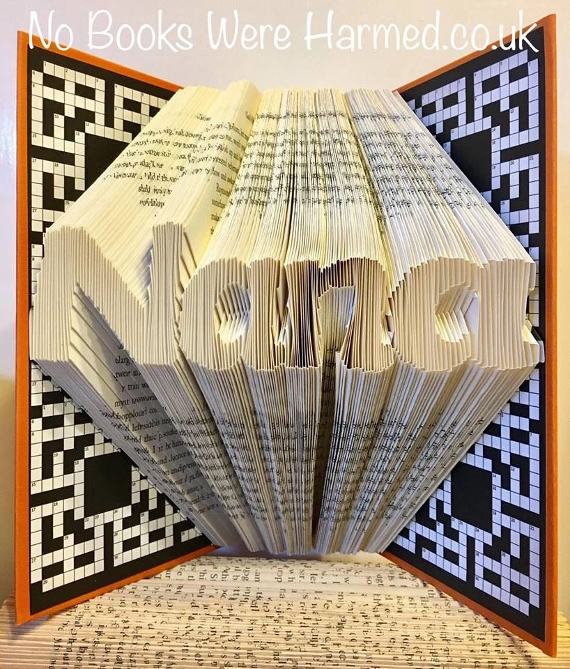 Hand-folded book art piece named 'Nana', crafted from vintage books, showcasing unique folds and textures.