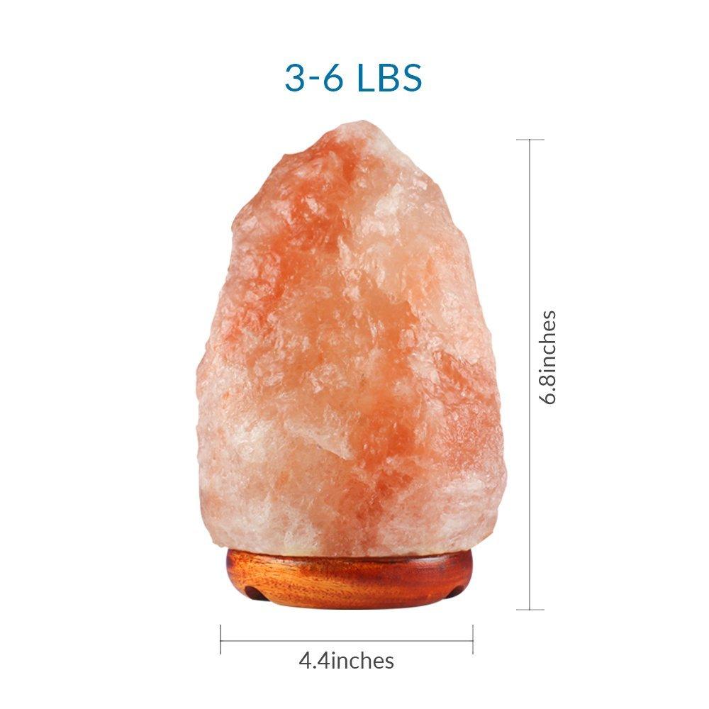 Natural Himalayan Salt Lamp, hand-carved, unique shape, glowing amber light, wooden base, 3-6 lbs.