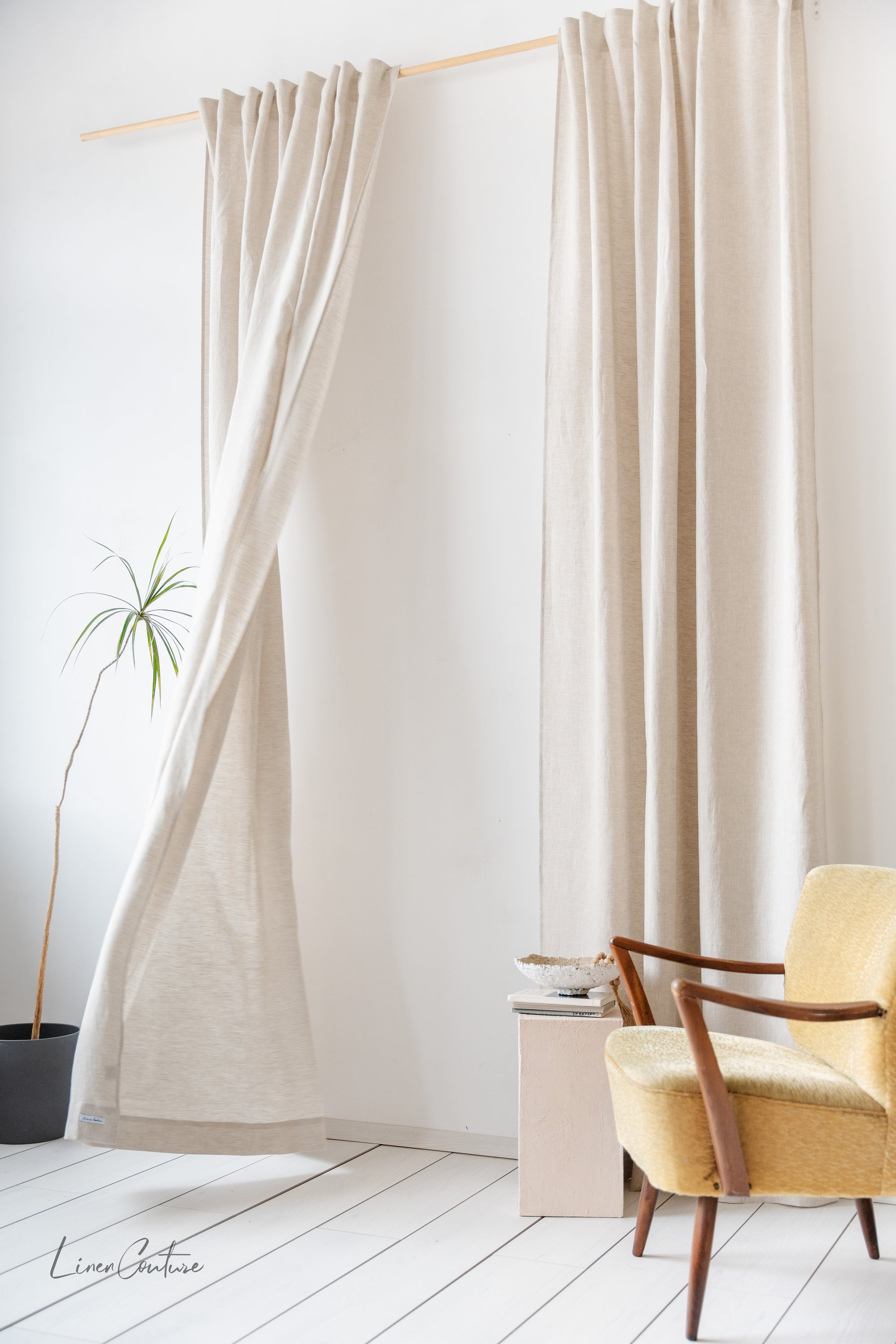 Natural Light linen curtain with multifunctional heading tape, showcasing its semi-sheer texture and elegant design in a cozy interior setting.