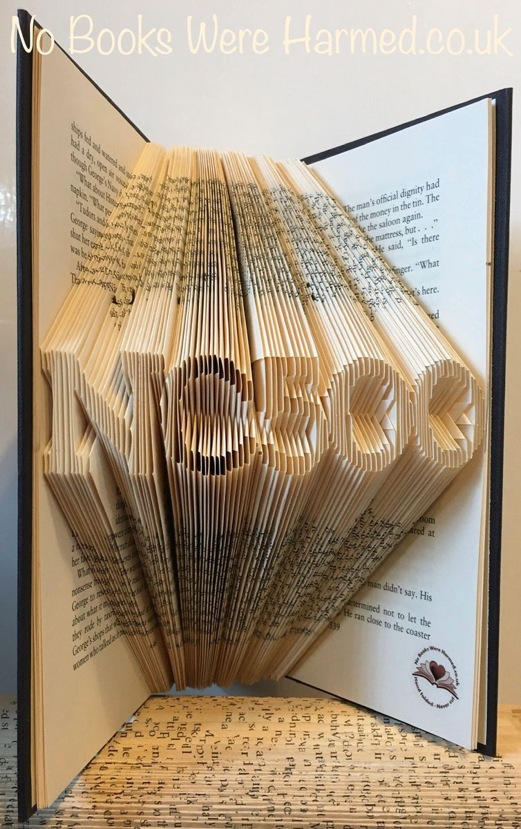 Handcrafted NC500 North Coast 500 souvenir made from vintage book pages, showcasing unique folded designs.