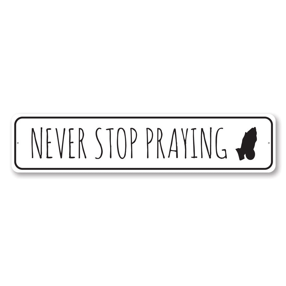 Never Stop Praying Sign made of durable aluminum, featuring inspirational text, perfect for home decor.