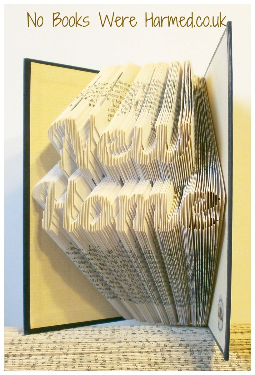 A unique piece of hand-folded book art made from vintage books, showcasing intricate designs and textures.