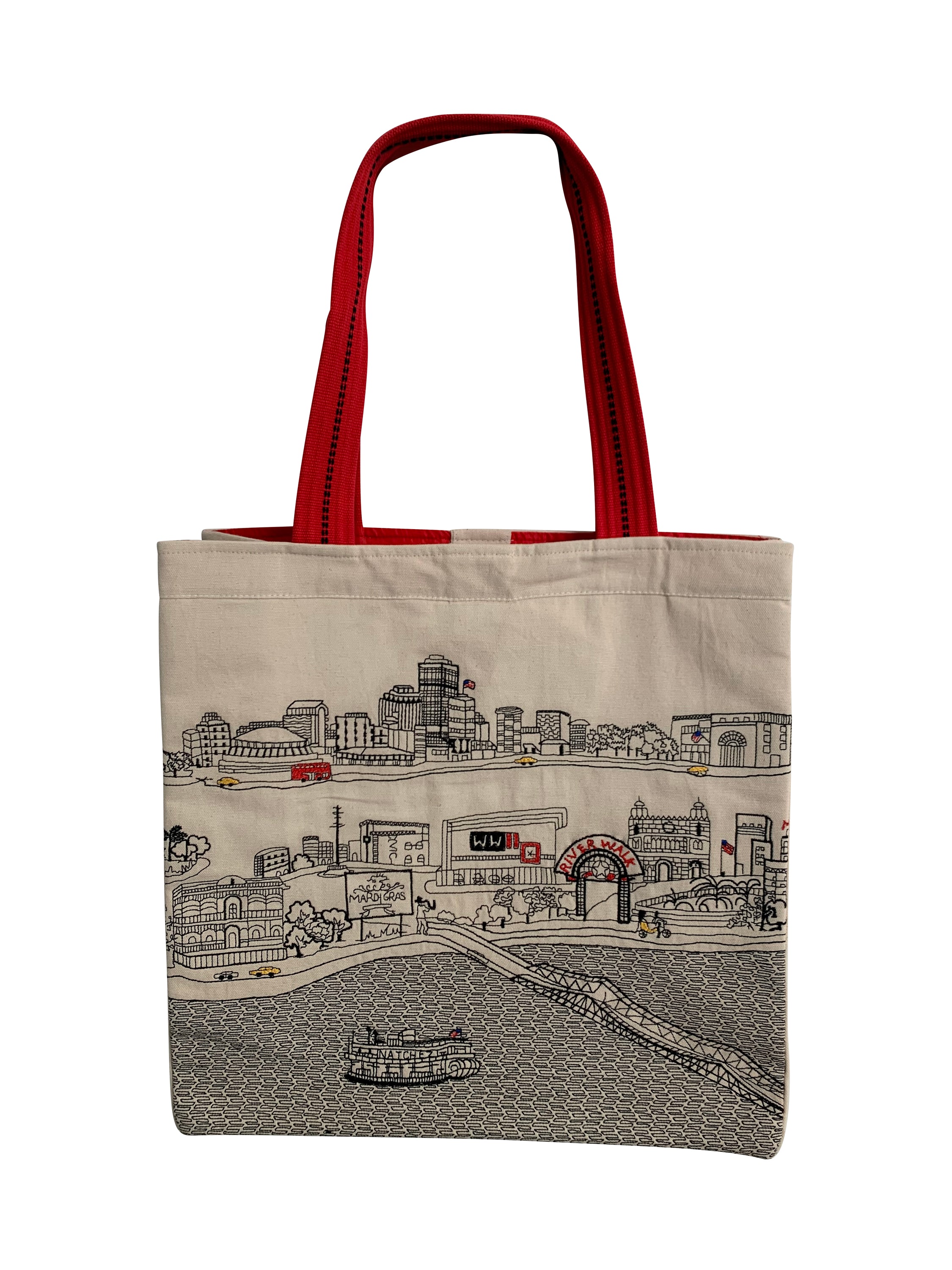 New Orleans Tote Bag featuring an embroidered skyline design on cream and black cotton canvas with red waterproof lining and straps.