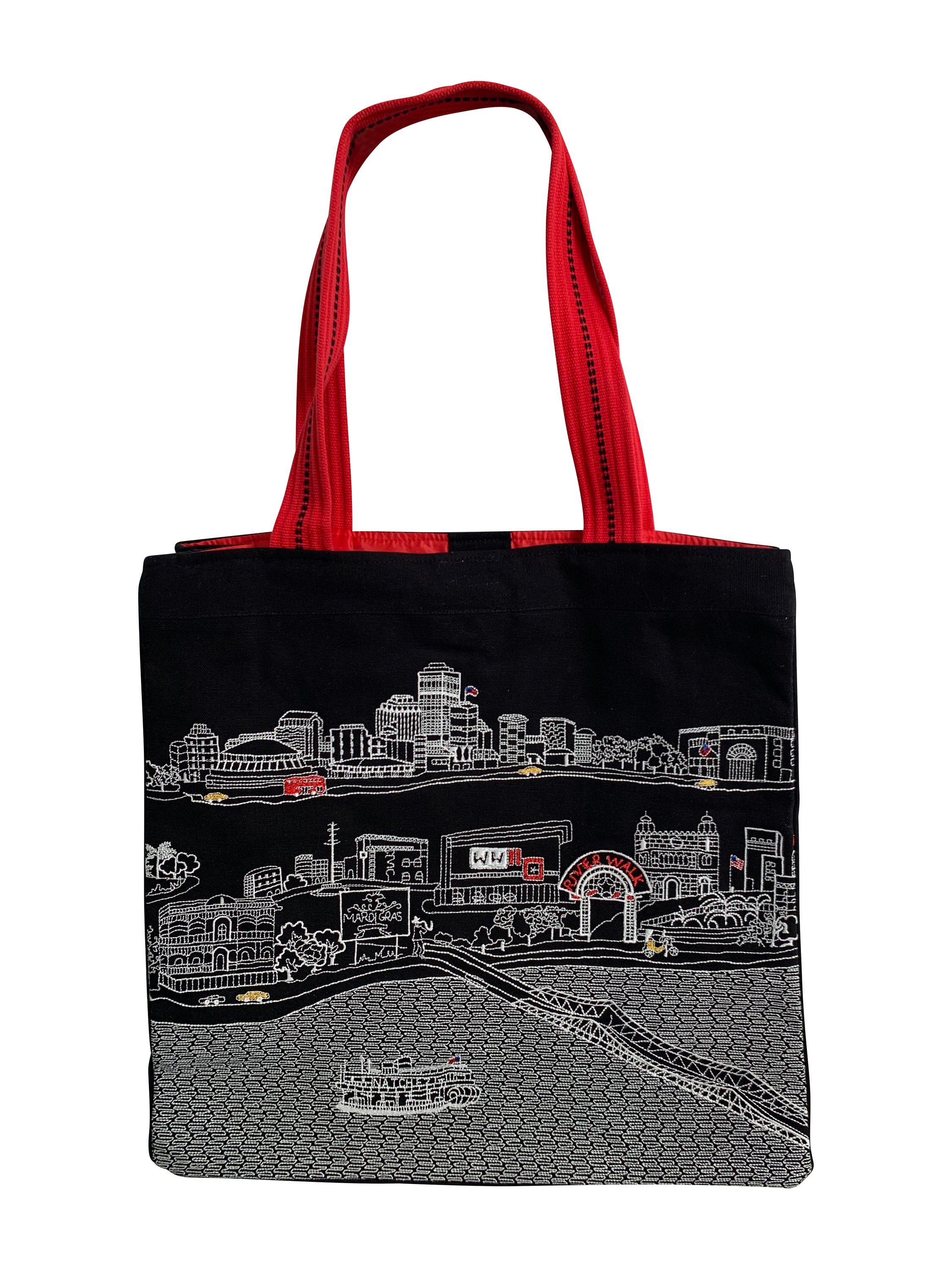 New Orleans Tote Bag featuring an embroidered skyline design on cream and black cotton canvas with red waterproof lining and straps.