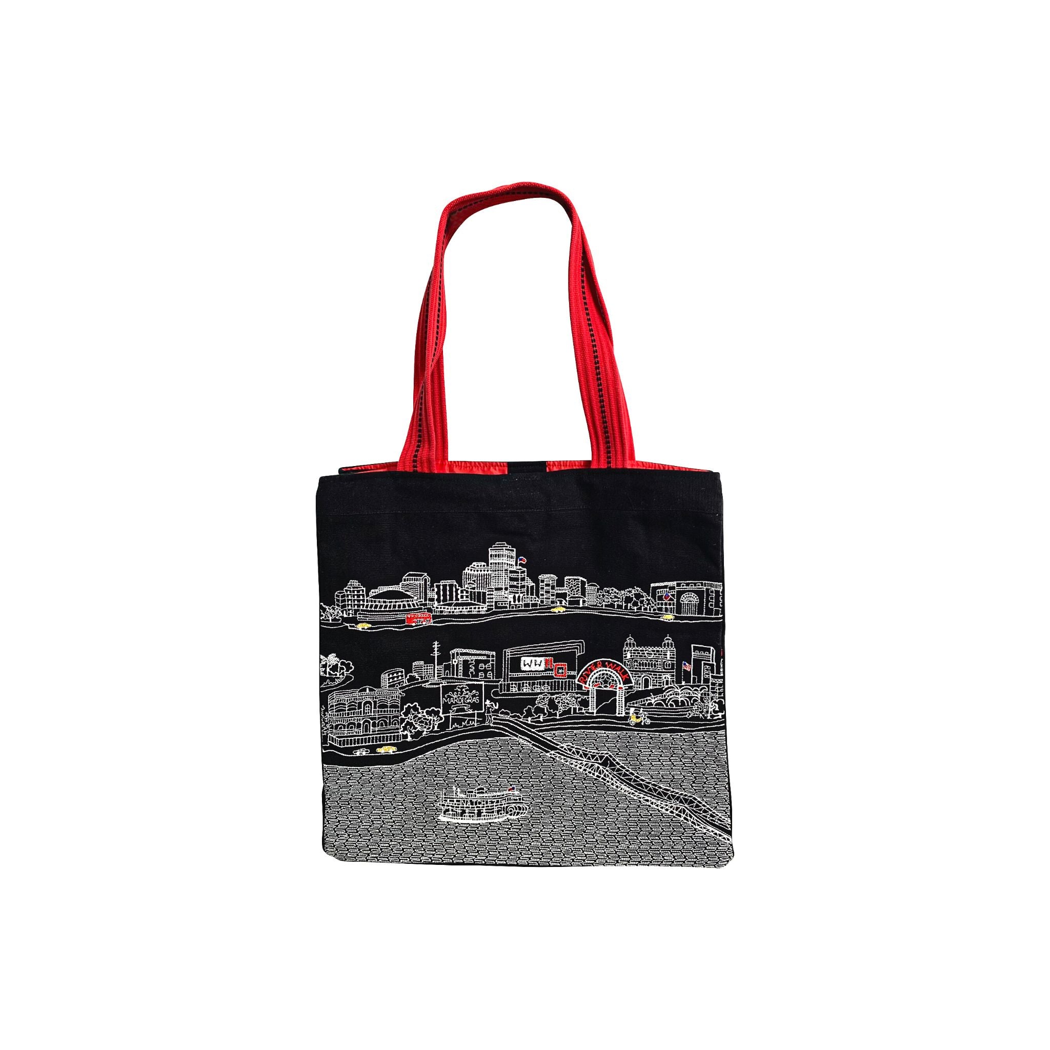 New Orleans Tote Bag featuring an embroidered skyline design on cream and black cotton canvas with red waterproof lining and straps.