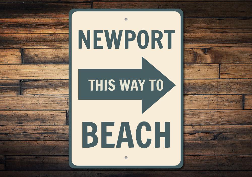 Newport Beach Arrow Sign made of high-quality aluminum, featuring customizable text and a coastal design, perfect for beach-themed decor.