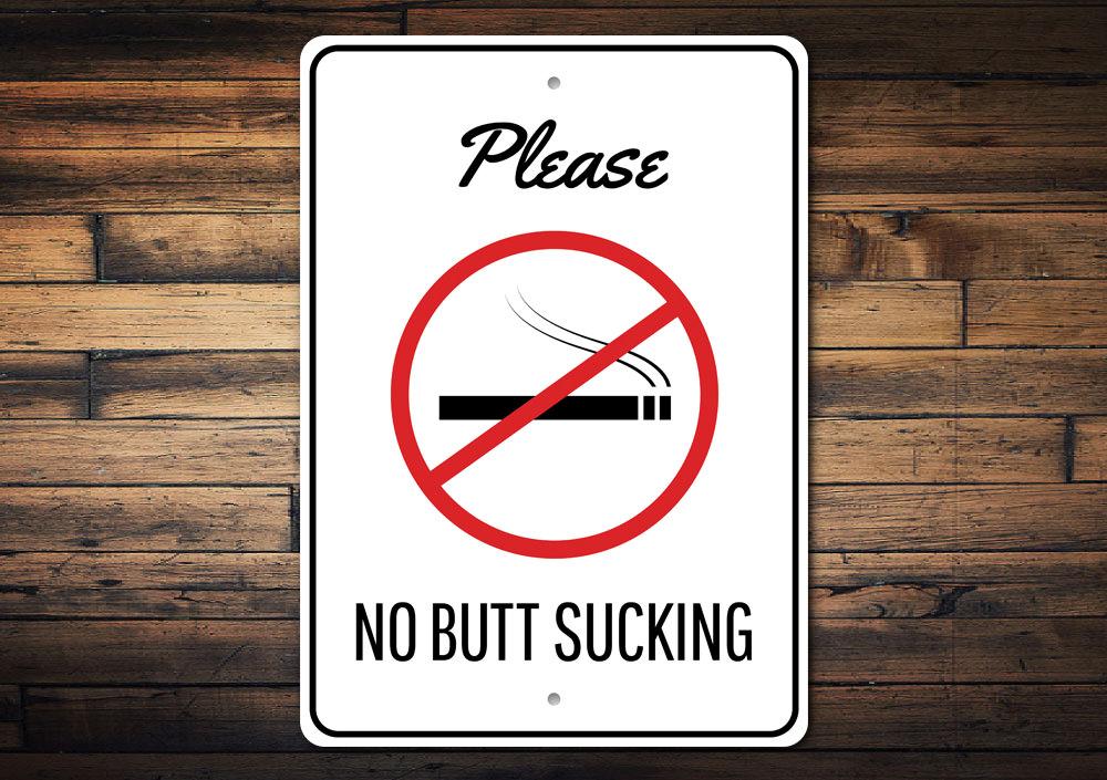 A humorous No Butt Sucking Sign made of high-quality aluminum, featuring bold text and a decorative design, perfect for home or office decor.