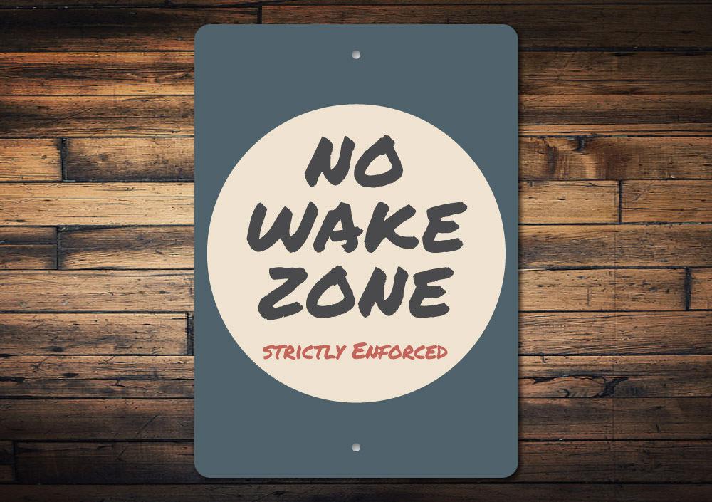 A vibrant No Wake Zone Sign made from durable aluminum, featuring customizable text and pre-drilled holes for easy mounting, perfect for lakeside properties.