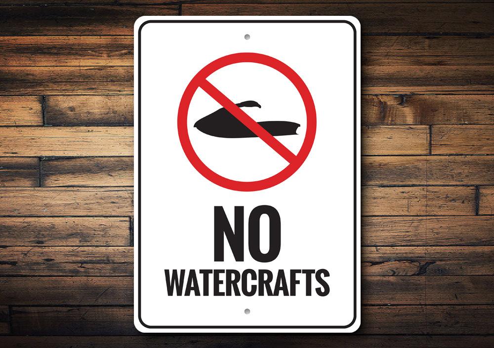 A decorative No Watercrafts Sign made of durable aluminum, featuring a coastal design suitable for beach houses and outdoor spaces.