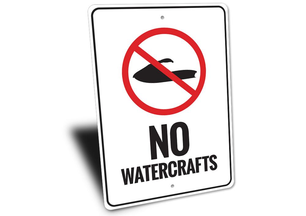 A decorative No Watercrafts Sign made of durable aluminum, featuring a coastal design suitable for beach houses and outdoor spaces.