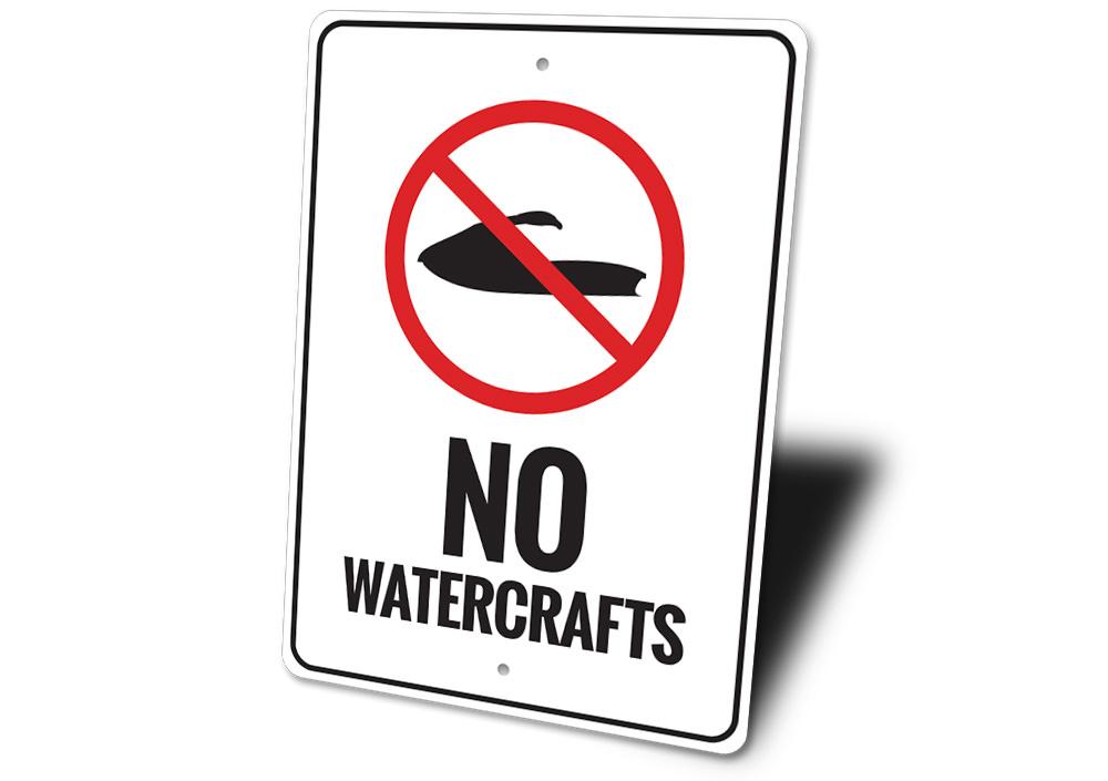 A decorative No Watercrafts Sign made of durable aluminum, featuring a coastal design suitable for beach houses and outdoor spaces.