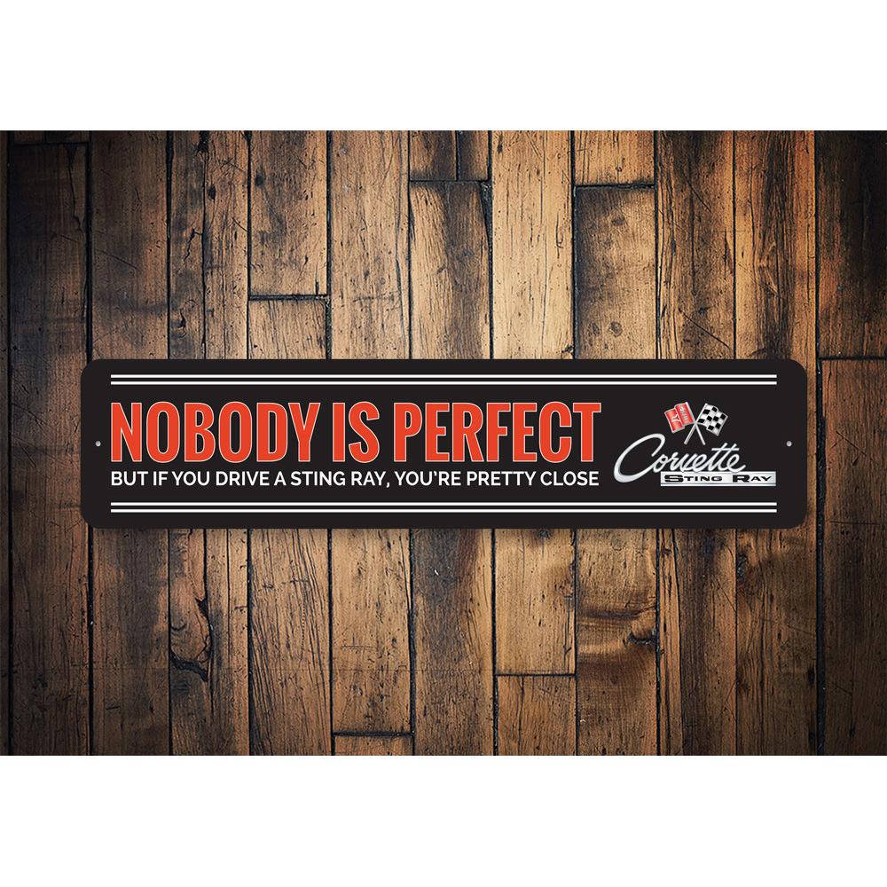 Nobody Is Perfect Chevy Corvette Sign made of durable aluminum, featuring a humorous design perfect for home decor.