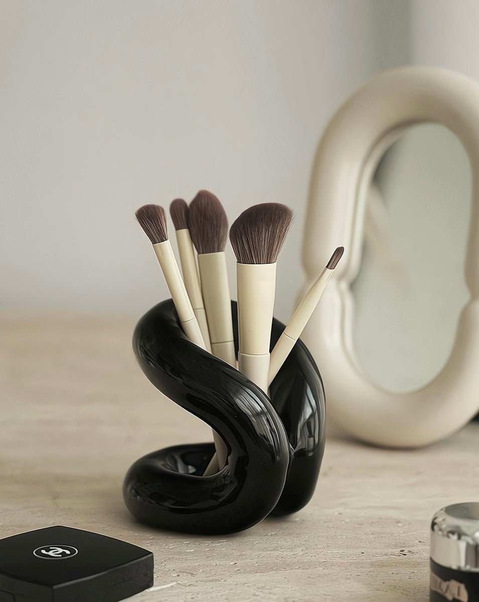 Nordic style ceramic foundation brushes holders elegantly displaying makeup tools on a vanity.