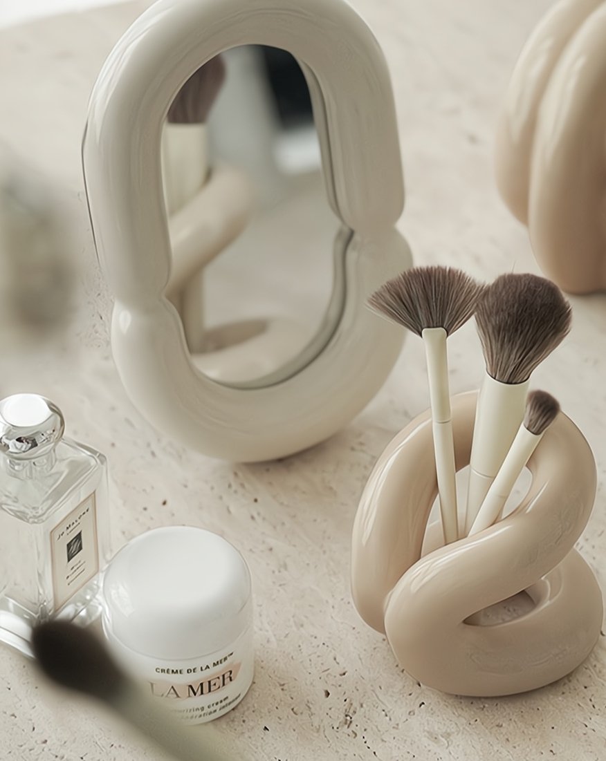 Nordic style ceramic foundation brushes holders elegantly displaying makeup tools on a vanity.