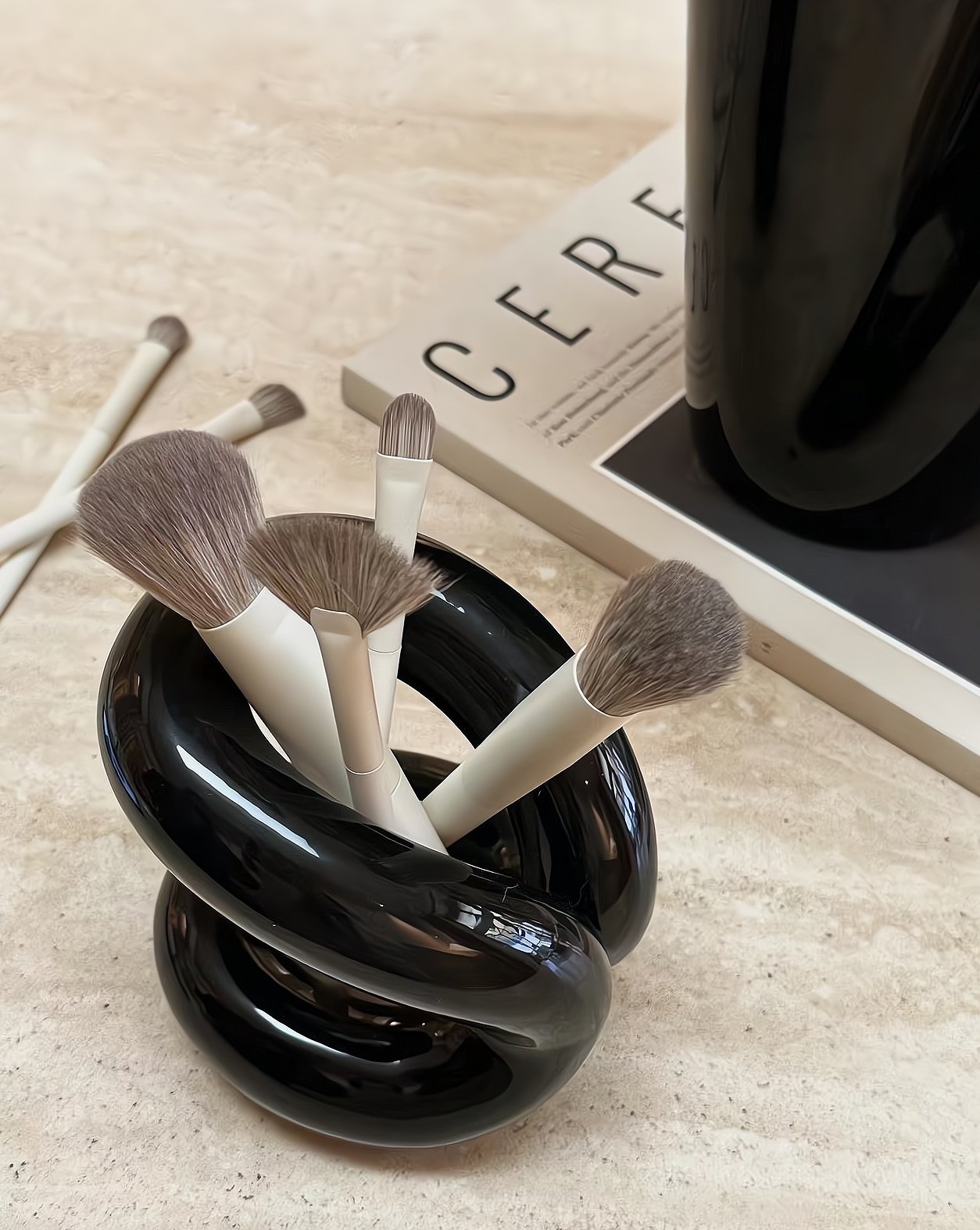 Nordic style ceramic foundation brushes holders elegantly displaying makeup tools on a vanity.