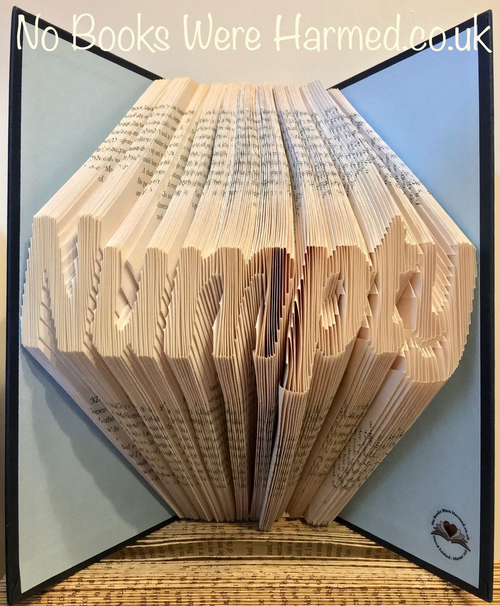 A unique piece of Numpty art made from hand-folded pages of vintage books, showcasing intricate designs and textures.