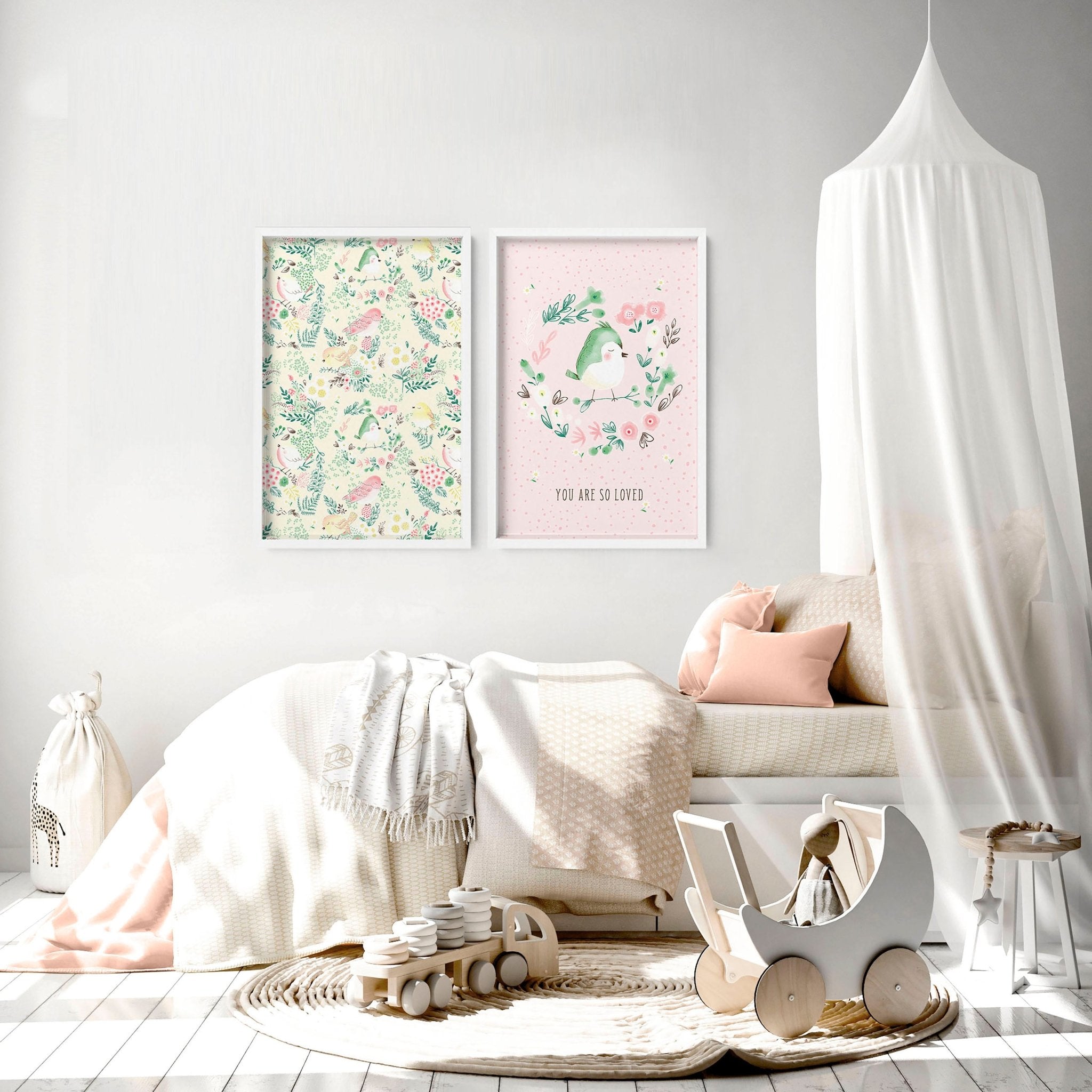 Set of 2 nursery wall art prints featuring cute pink and ivory birds and a floral illustration, perfect for a little girl's room.