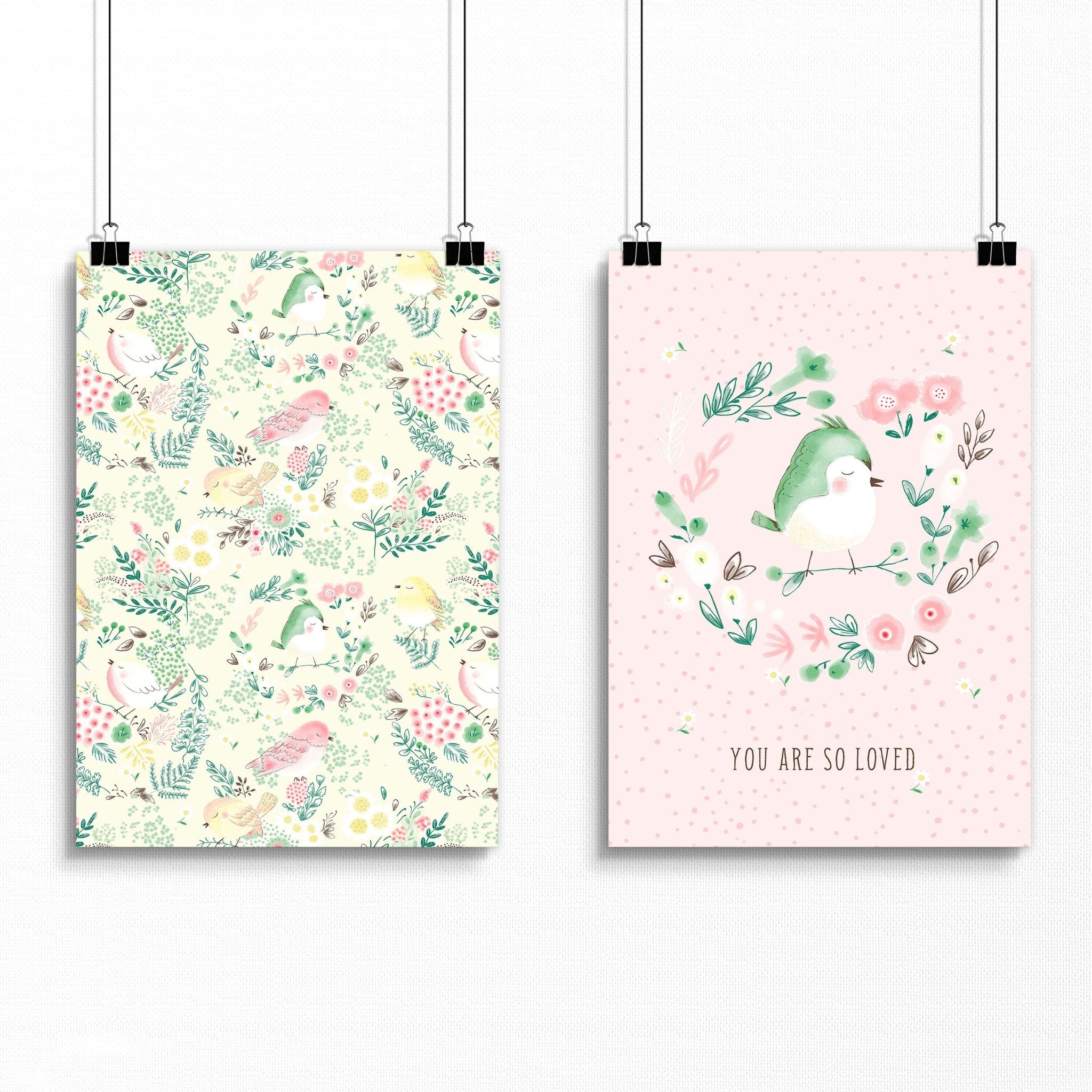 Set of 2 nursery wall art prints featuring cute pink and ivory birds and a floral illustration, perfect for a little girl's room.