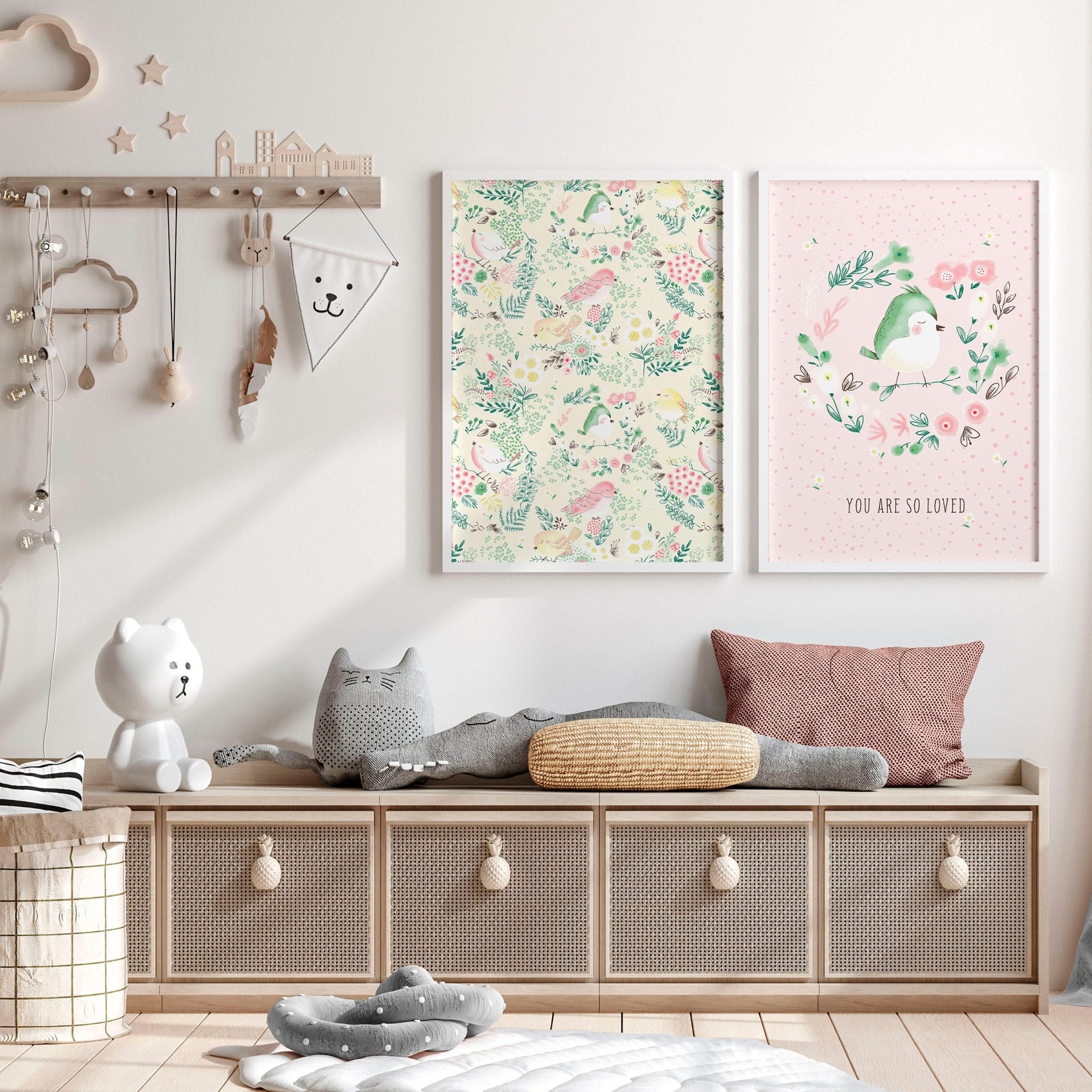 Set of 2 nursery wall art prints featuring cute pink and ivory birds and a floral illustration, perfect for a little girl's room.