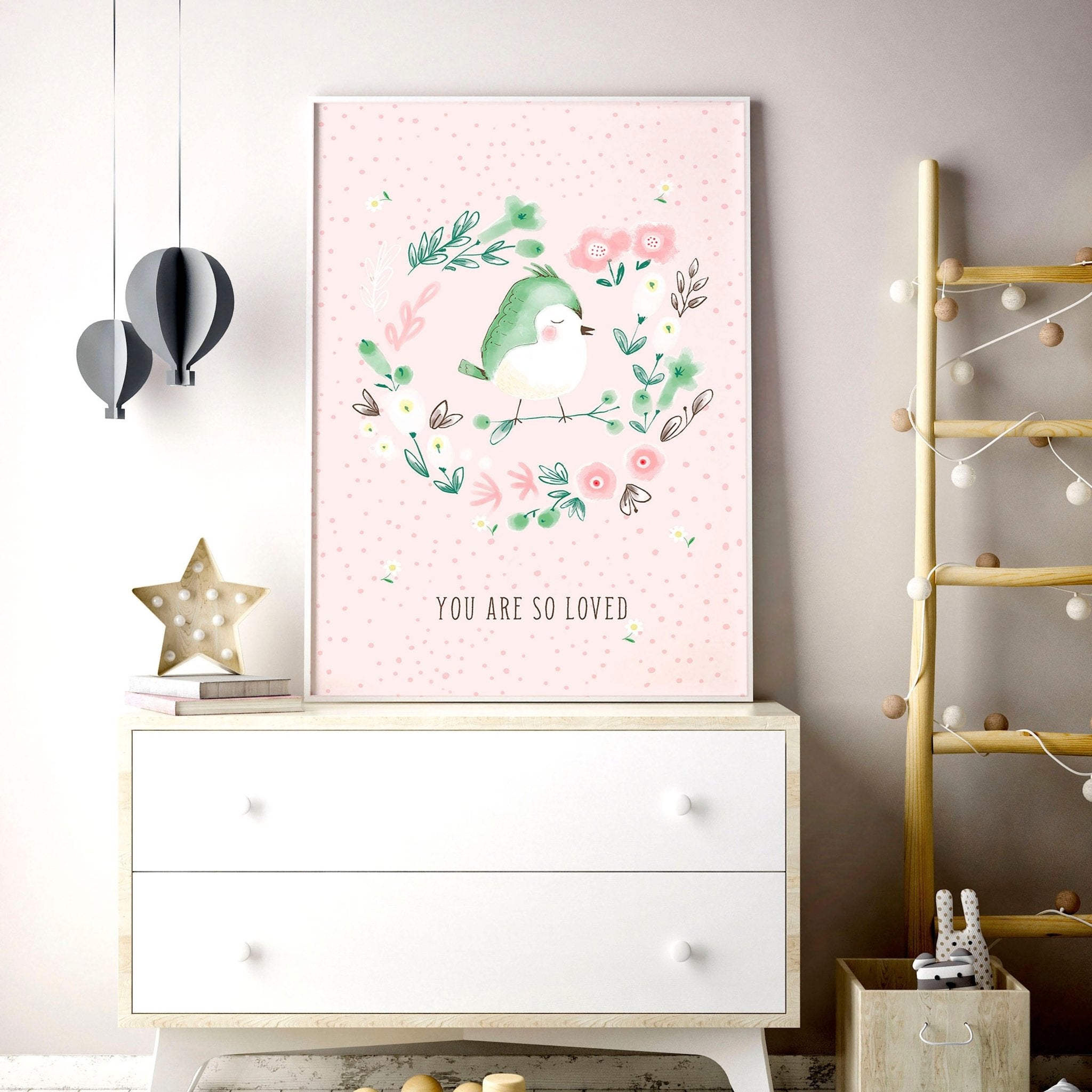 Set of 2 nursery wall art prints featuring cute pink and ivory birds and a floral illustration, perfect for a little girl's room.