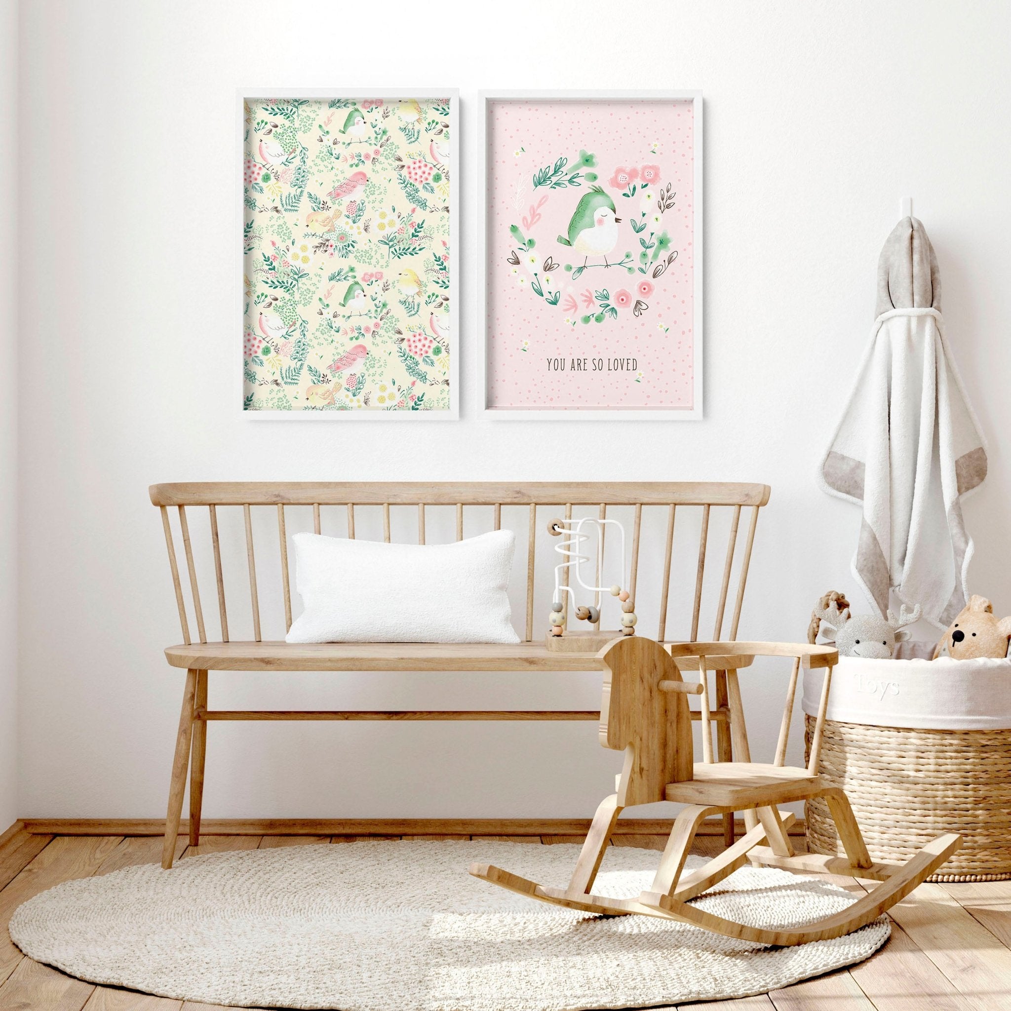 Set of 2 nursery wall art prints featuring cute pink and ivory birds and a floral illustration, perfect for a little girl's room.