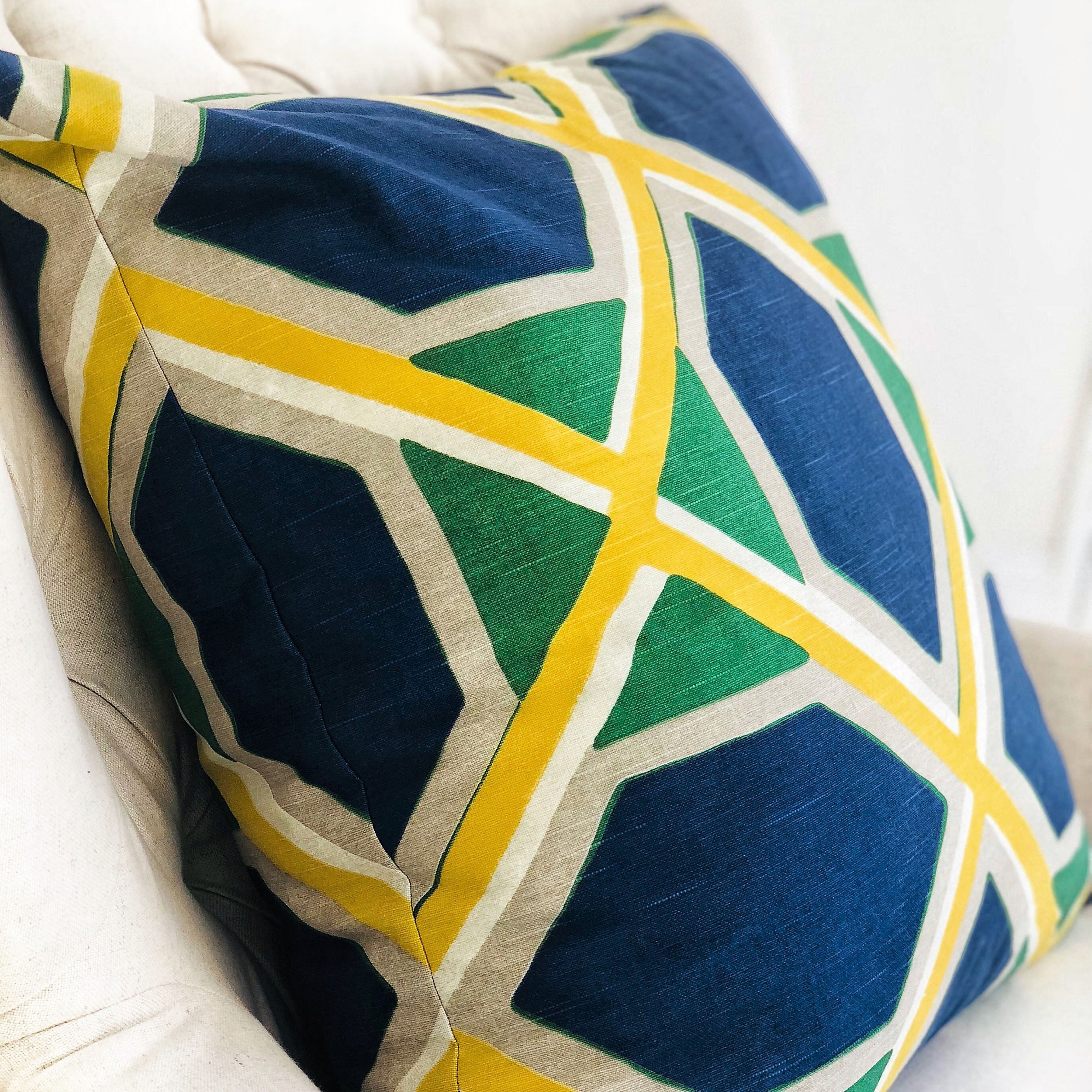 Obliquity Blue, Yellow and Green Luxury Throw Pillow featuring geometric patterns and vibrant colors, handmade in the USA.