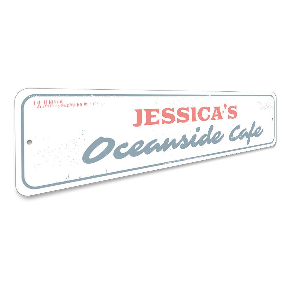 Oceanside Cafe Sign made of durable aluminum, featuring beach-themed design, perfect for coastal decor.