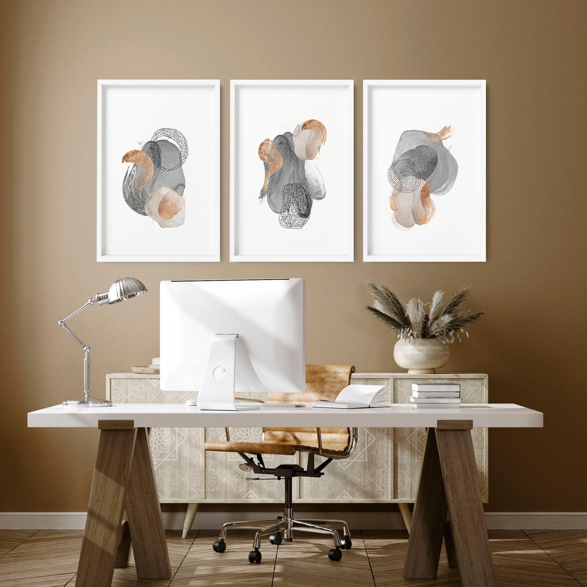 Set of 3 framed wall art prints featuring Abstract Neutral designs in grey, mauve, and gold tones, perfect for office decor.