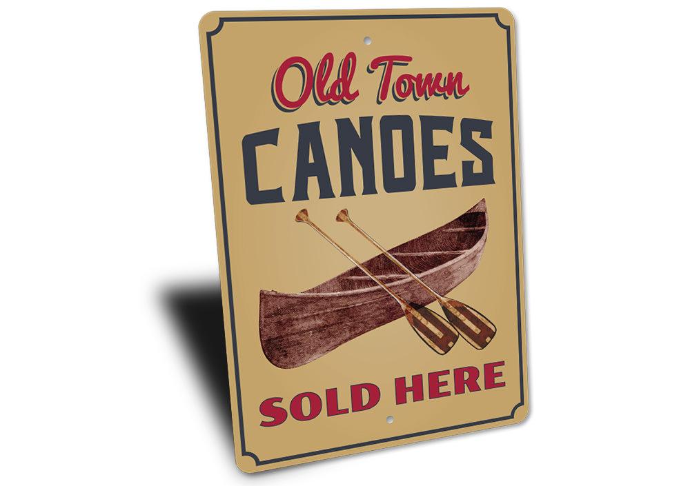 Old Town Canoes Sign made of high-quality aluminum, featuring a decorative design perfect for lakeside homes.