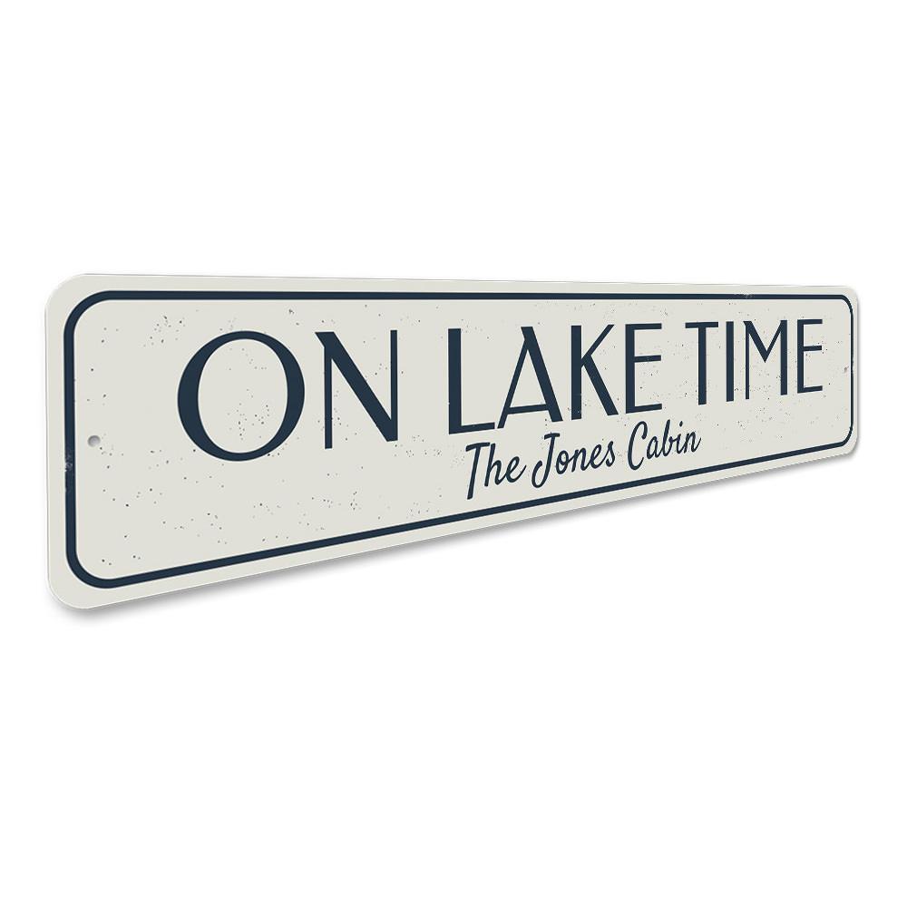 On Lake Time Sign made of durable aluminum, featuring a rustic design perfect for lakehouse decor.