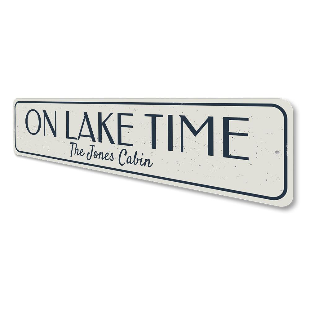 On Lake Time Sign made of durable aluminum, featuring a rustic design perfect for lakehouse decor.