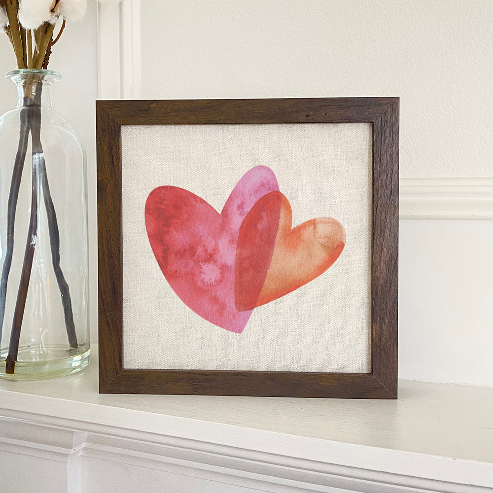 Orange and Pink Double Heart Framed Sign with a stylish wood frame, featuring a linen-look background and eco-friendly ink printing.