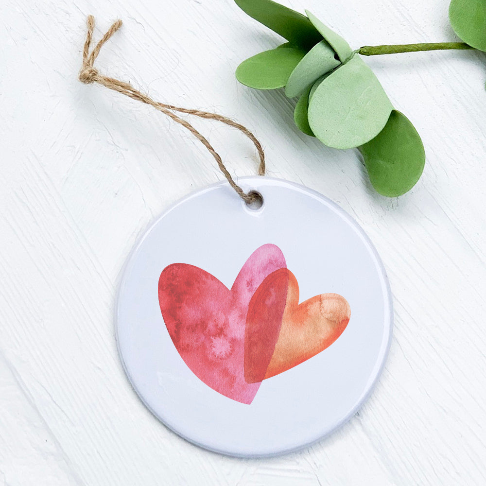 Orange and Pink Double Heart Ornament made of high-quality porcelain with a smooth gloss finish, featuring a vibrant heart design.