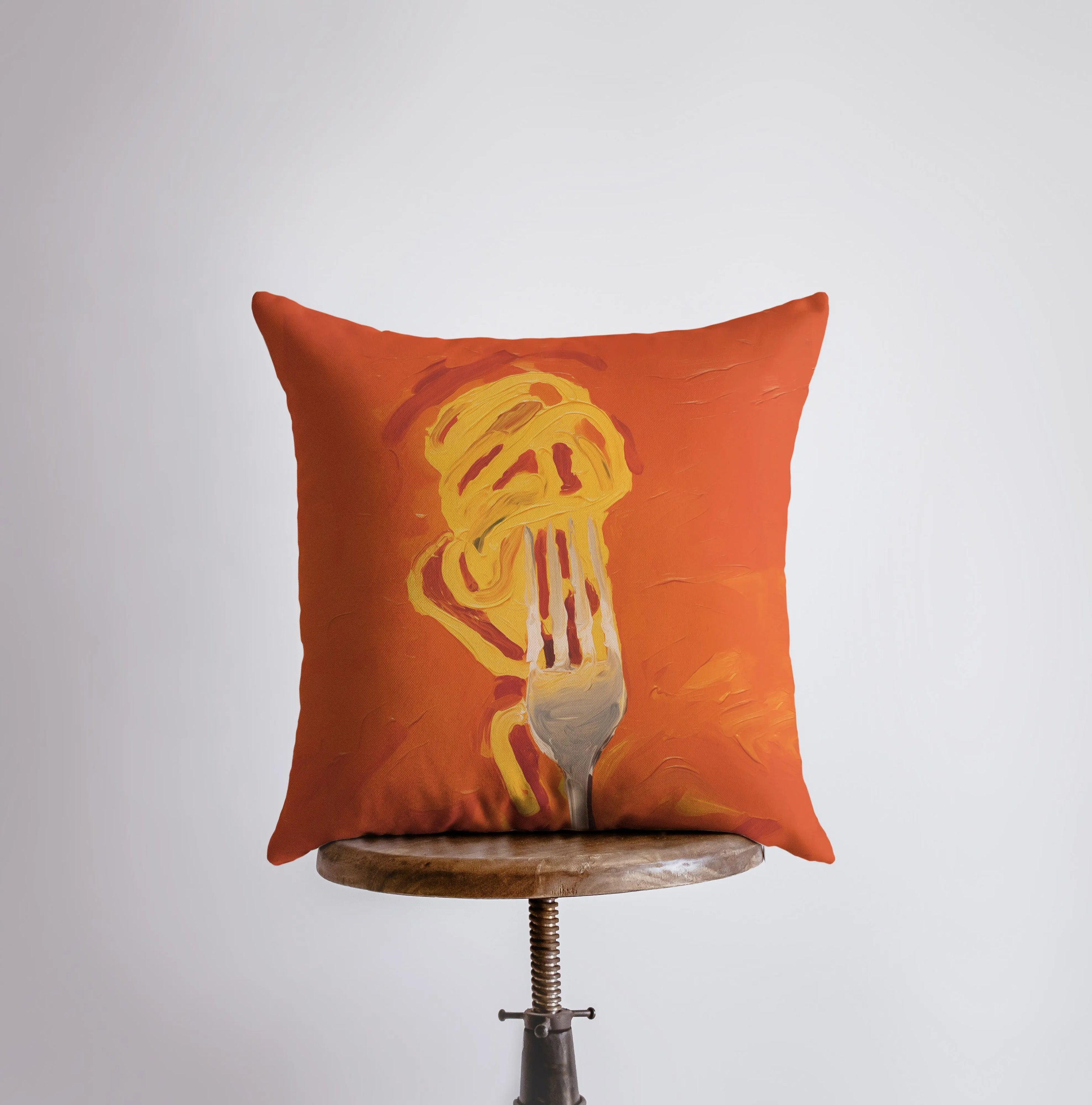 Orange Fork and Pasta decorative pillow featuring a vibrant design on the front and a white back, perfect for home decor.