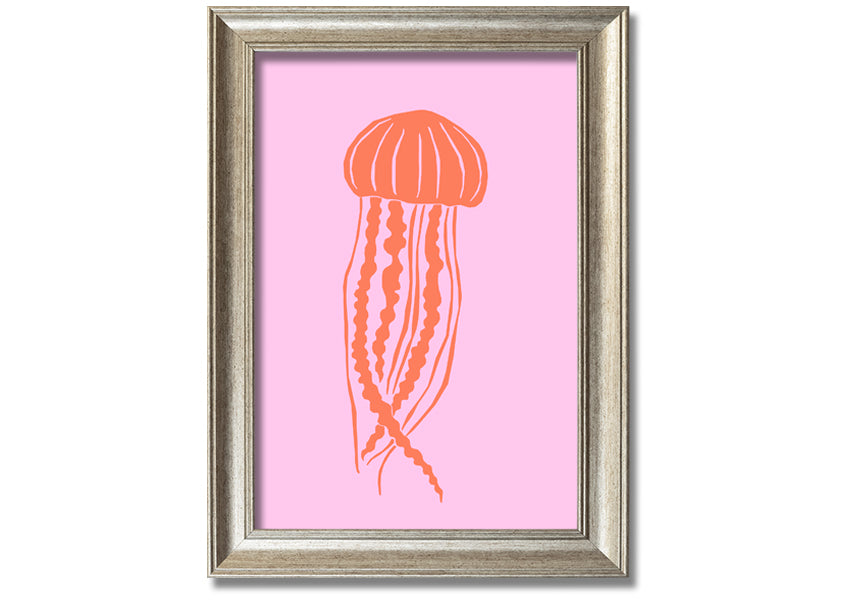 Framed print of an orange jellyfish on a pink background, showcasing vibrant colors and intricate details.