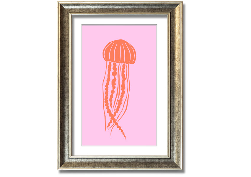 Framed print of an orange jellyfish on a pink background, showcasing vibrant colors and intricate details.