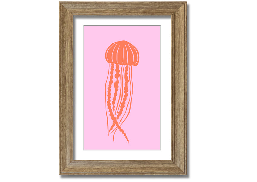 Framed print of an orange jellyfish on a pink background, showcasing vibrant colors and intricate details.