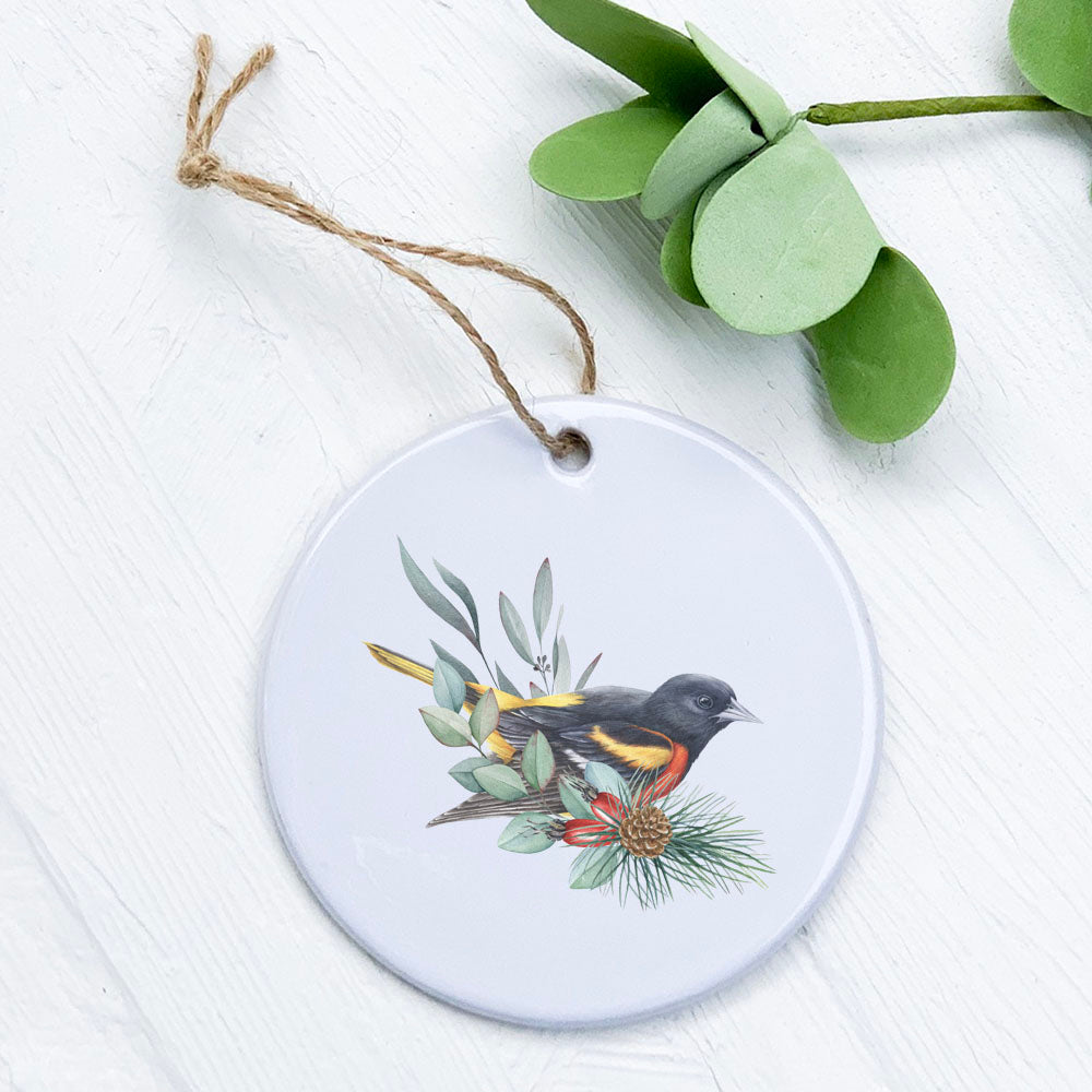 A beautifully crafted porcelain ornament featuring an oriole design, perfect for seasonal decor or gifting.