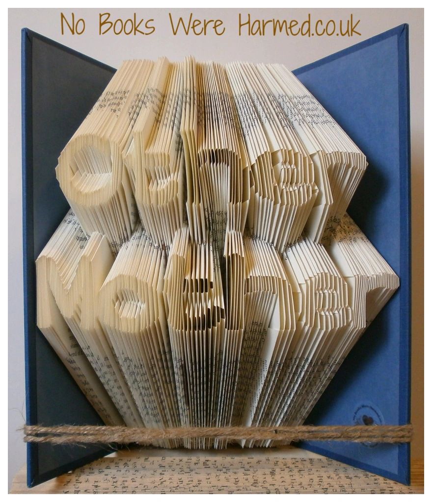 Hand-folded book art titled 'Other Mother', showcasing intricate designs made from vintage book pages.