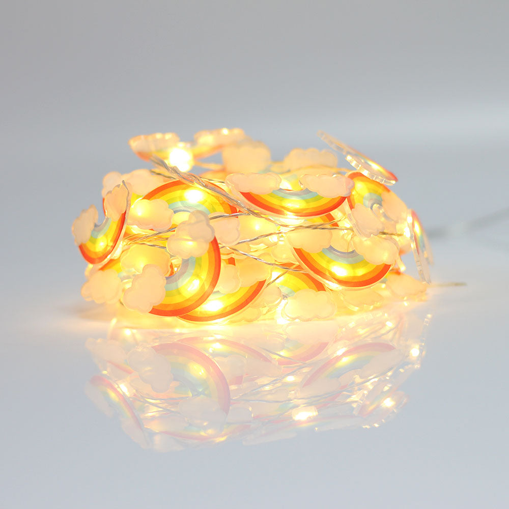 Outdoor 30LEDs Super Clouds String Lights illuminating a garden with bright white light, showcasing their crystal globe design.