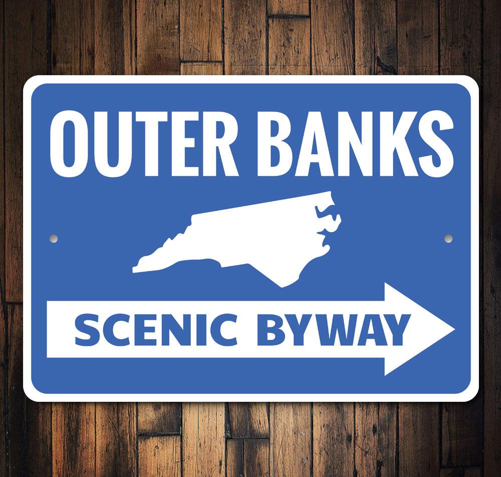 Outer Banks Arrow Sign made of high-quality aluminum, featuring customizable text and pre-drilled holes for easy mounting.