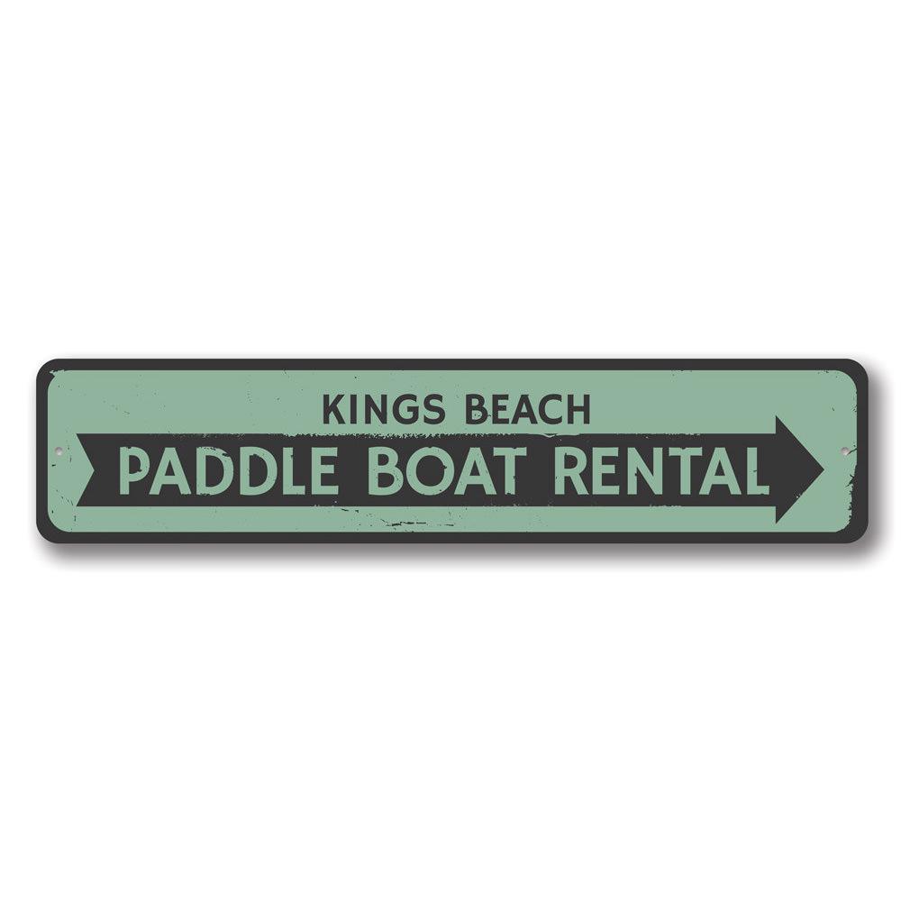 A vibrant Paddle Boat Rental Sign made of durable aluminum, featuring customizable text and pre-drilled holes for easy mounting, perfect for beach-themed decor.