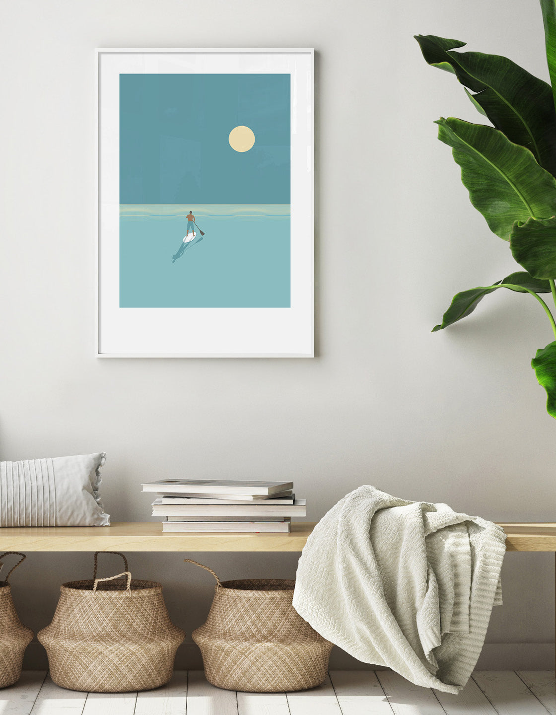 A serene paddleboarder silhouetted against a vibrant sunset, showcasing cool blues and minimalist design.