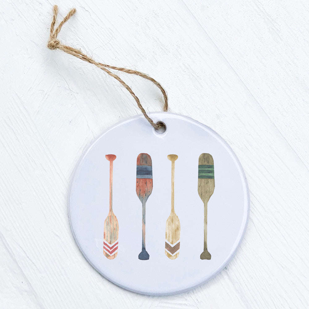 A beautifully crafted porcelain ornament featuring original paddle designs, perfect for gifting or home decor.